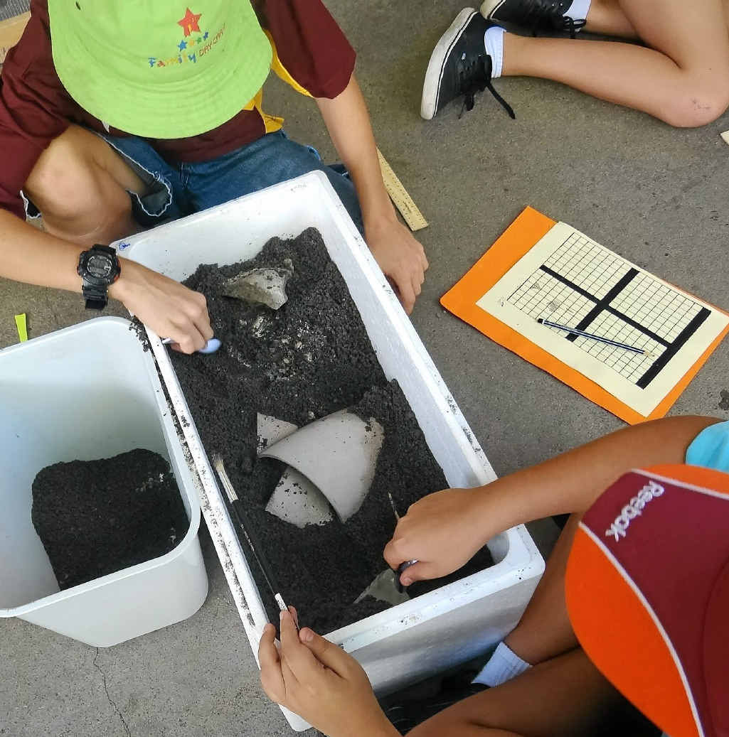 Year 7 students eagerly excavate their box of hidden treasures. Year 7 students eagerly excavate their box of hidden treasures.